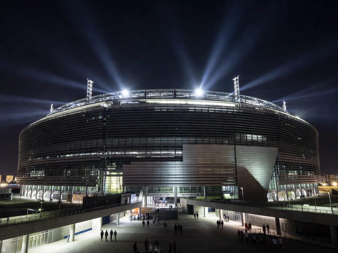 Exterior view of soccer stadium MetLife lit up for tournament at night